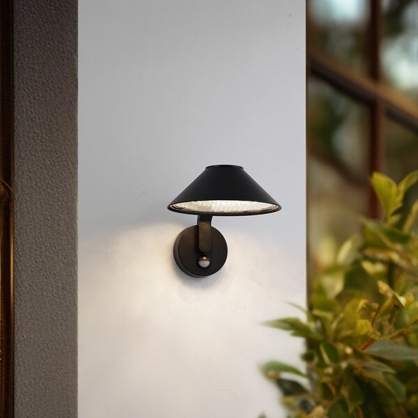 Lindby LED απλίκα Capelo, μαύρο, μέταλλο, αισθητήρας, Ø20cm, Μαύρο, Αλουμίνιο, σύγχρονο